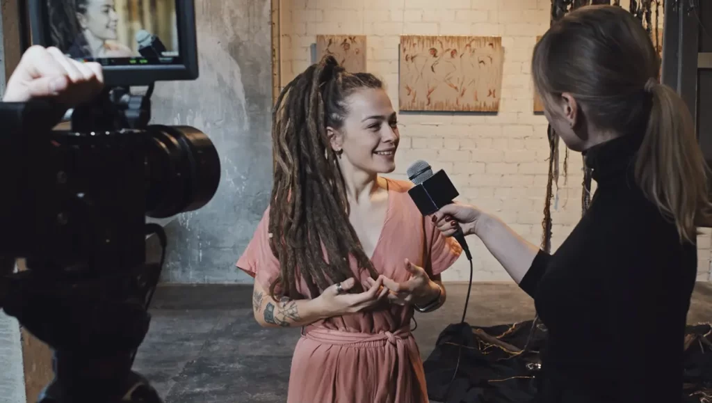 Lady Interviewed TV Camera